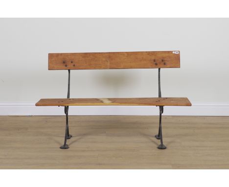 A 19TH CENTURY AND LATER BLACK PAINTED CAST IRON FRAMED GARDEN BENCHWith oak slats, the supports numbered 335 S, 137cm wide; 