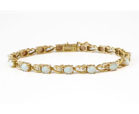 AN OPAL AND DIAMOND BRACELETSet with oval cabochon opals and round brilliant diamonds in a fancy link bracelet with a box cla