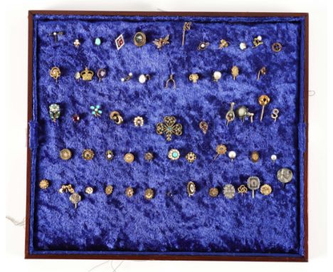 A COLLECTION OF SIXTY-ONE STICK PINS (62)To include; a pietra dura floral stick pin, a diamond and seed pearl arrow stick pin