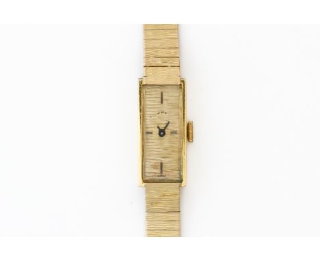 A 9CT WATCHES OF SWITZERLAND WATCHWith Swiss 17 jewels movement, rectangular face signed W of S, in a 9ct case, with 9ct text