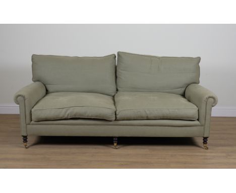 GEORGE SMITH; A GREEN UPHOLSTERED THREE SEATER SOFA215cm wide; 80cm highGood overall condition upholstery is in used conditio