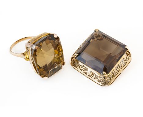 A SMOKY QUARTZ RING AND BROOCH (2)Ring claw set with a rectangular mixed cut smoky quartz, size N, brooch claw set with a squ