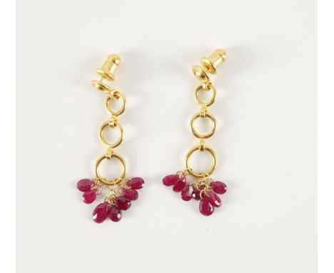 A PAIR OF GURHAN RUBY EARRINGS (2)With three graduating rings suspended from the stud marked Gurhan, with pear briolette cut 