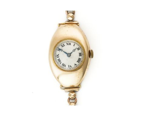 A LONGINES GOLD OVAL CASED LADY'S WRISTWATCHThe circular silvered dial with black Roman hour numerals and a signed circular j