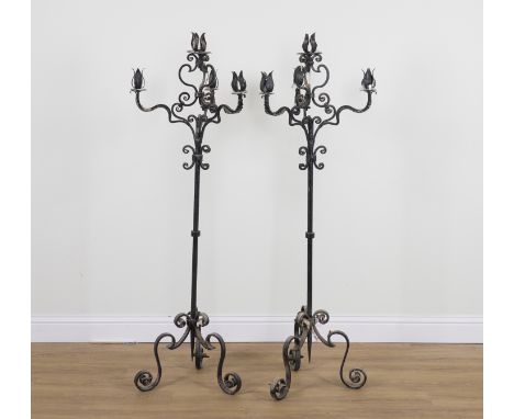A PAIR OF BLACK PAINTED WROUGHT IRON FOUR BRANCH FLOOR STANDING CANDLEABRA (2)20th Century Each with three branches and one c