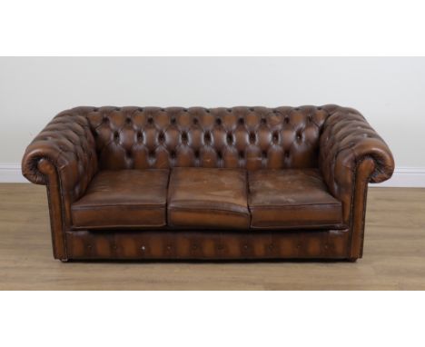 A CHESTERFIELD SOFAWith faux brown leather buttonback upholstery, 190cm wide; 71cm high