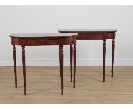 A PAIR OF MAHOGANY BOW FRONT SINGLE DRAWER CONSOLE TABLES (2)On baluster reeded supports, 99cm wide; 36cm deep; 84cm highBoth