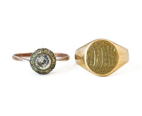 A GOLD SIGNET RING AND A COLOURLESS PASTE CLUSTER RING (2)The oval signet ring monogram engraved, detailed 18 CT K and L, rin