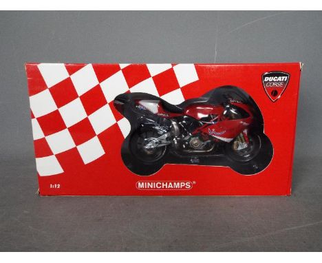 Minichamps - A 1:12 scale Ducati Desmosedici Moto GP - Prova 2002. The model appears Mint in a Very Good box with light stora