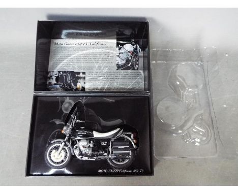 Minichamps - A 1:12 scale Moto Guzzi California 850-T3 motorcycle. The right mirror has snapped off and is taped inside the b