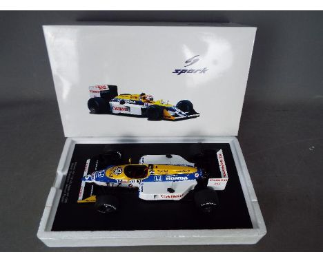 Spark - A 1:18 scale 1987 Williams FW 11B number 6 Formula 1 car as driven by Nelson Piquet in the Japan Grand Prix. The mode