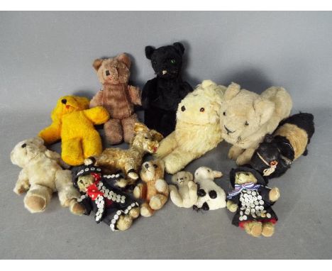 Unconfirmed Makers - A menagerie of 13 vintage and modern teddy bears and soft animal toys. Lot includes, Lions, bears, a cow