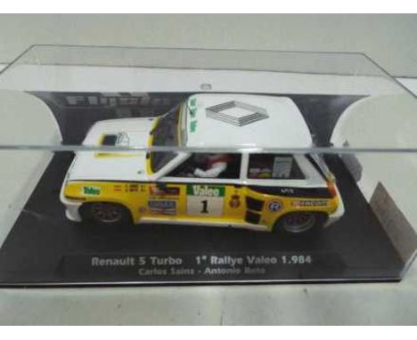 Flyslot - Renault 5 Turbo Carlos Sainz Rally Valeo 1984 in a perspex display case. # 037101. The car appears Mint in a Near M