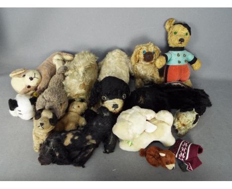 A family of 14 vintage and modern teddy bears and soft animal toys. Toys appear to be in Poor - Fair condition generally in a