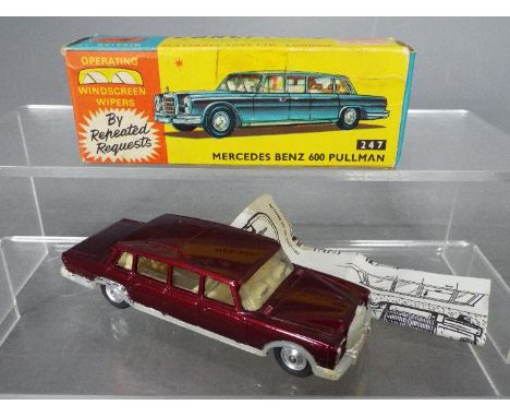 Corgi Toys - A boxed Corgi #247 Mercedes Benz 600 Pullman. The model in Metallic maroon with cream interior, spun hubs and fe