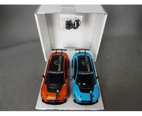 Scalextric - 2 x unboxed Jaguar i Pace racing slot cars which are slightly dusty from being out on display but appear to be N