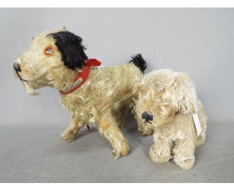 Unconfirmed Maker - Two vintage terrier soft toys both unmarked. The largest appears straw filled, has amber and black glass 