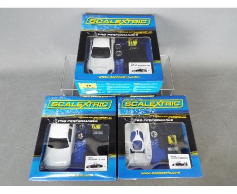 Scalextric - 3 x self assembly slot cars including Chevrolet Impala # C3083, Lola Aston Martin # C3193, Aston Martin DBR9 # C