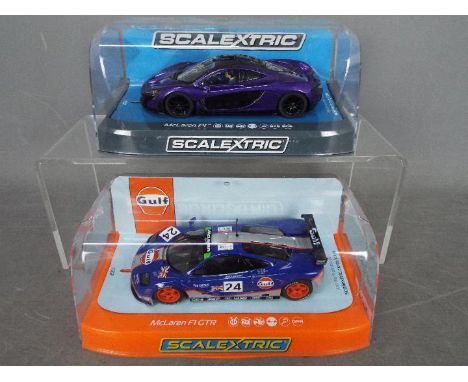 Scalextric - 2 x McLaren slot cars, an F1 GTR in Gulf livery, # C3969 and a P1 in purple # C3842. Both models appear Mint in 