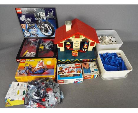 LEGO - A vintage Lego System motorised Swiss Cottage - possibly an ex-shop display piece. The cottage measures approximately 