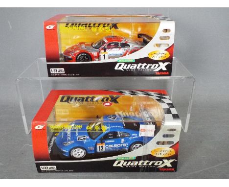 Scalextric - Takara - 2 x Nismo Nissan 350 Z slot cars from the Quattro X range, # QX01, # QX02. Both models appears Mint in 