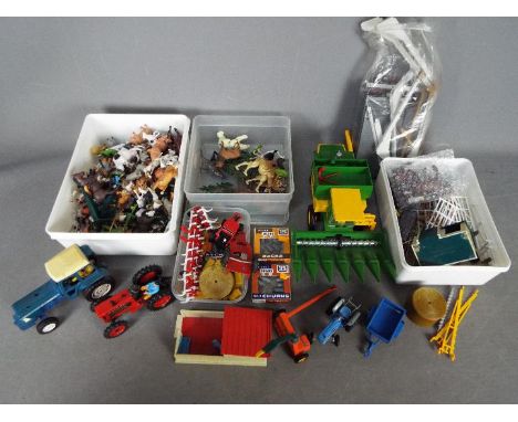 Britains - A small collection of unboxed Britains diecast farm vehicles and implements, with a large quantity of loose plasti