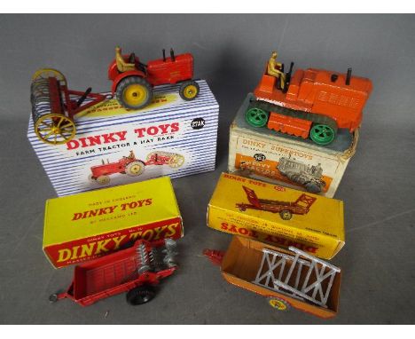 Dinky Toys - Four boxed Dinky Toys. Lot includes Dinky #27AK Farm Tractor and Hay Rake; #320 Harvest Trailer; #321 Massey Har