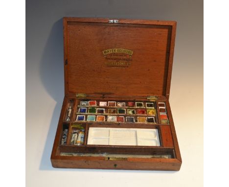 A Victorian mahogany rectangular artist's box, by Reeves & Sons Ltd, London, hinged cover enclosing colours and a ceramic pal