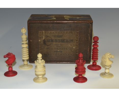 A 19th century turned ivory chess set, in the manner of Calvert, from 46, Cornhill, London, stained red and natural, the king