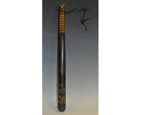 A Victorian turned and ebonised truncheon, inscribed with VR cypher, B.N 1825, ring grip, leather wrist strap, 45.5cm long