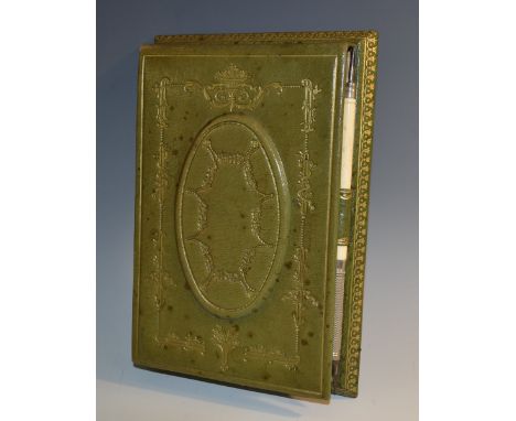 An Edwardian tooled and gilt leather memorandum writing pad, hinged cover decorated in the neoclassical taste, enclosing prov