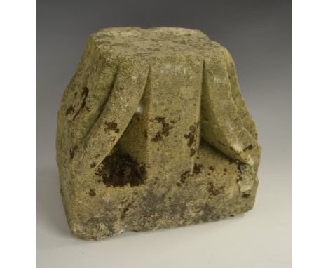 A post-Medieval limestone capital or fragment, carved opposing arcs, 19cm high, 20cm wide 
