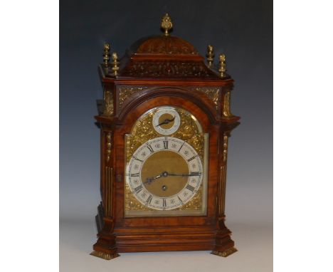 A 19th century gilt metal mounted walnut bracket timepiece, 14cm arched brass dial with silvered chapter ring inscribed with 