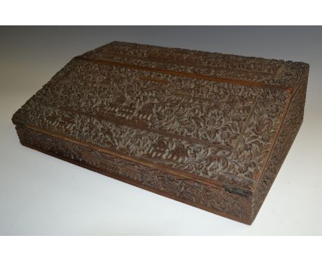An Anglo-Indian hardwood writing slope, central purple velvet lined writing surface, well apertures, pen and sealing wax tray