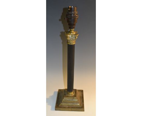 An early 20th century ebony and brass Corinthian column table lamp, reeded pillar, stepped square base, 39cm high, c.1925