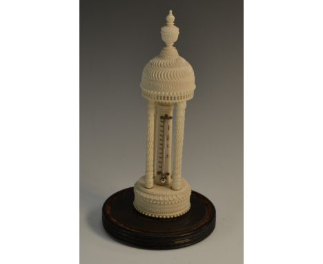 A 19th century Anglo-Indian ivory portico desk thermometer, urnular finial, above four pillars, 'engine-turned' and carved wi