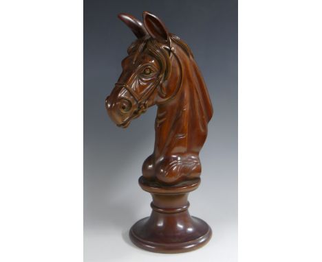 An unusual late Victorian/Edwardian mahogany oversize chess piece, possibly a shop display, well carved as a knight, waisted 