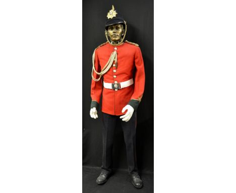 Military - an army bandsman's uniform, with belt and whistles, displayed on a mannequin,192cm high overall 