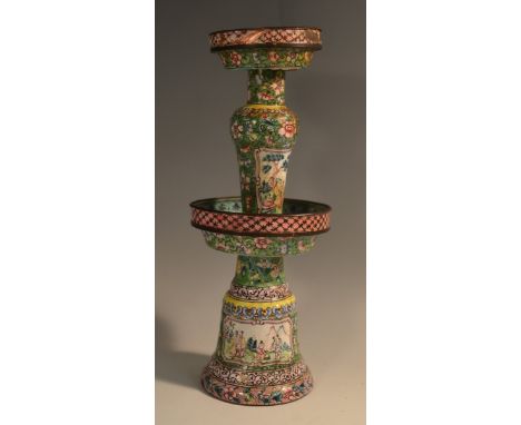 A Chinese enamel pricket candlestick, decorated in the famille verte palette with figures, flowers and scrolls, 22.5cm high, 