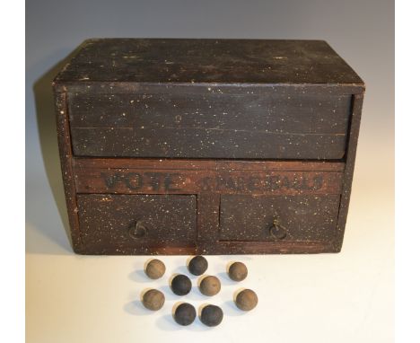 A Victorian stained pine ballot box, hinged cover enclosing a division flanked by a pair of apertures, above drawers containi