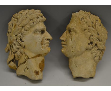 A pair of 19th century Grand Tour composition portrait bust plaques of caesars, facing to dexter and sinister, 13 and 12.5cm 