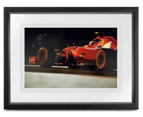 Stunning 18 x 12-inch photographic print, signed by 2007 Ferrari F1 World Champion, Kimi R&auml;ikk&ouml;nen. A limited editi