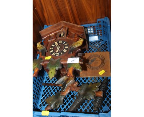 A CARVED WOODEN CUCKOO CLOCK