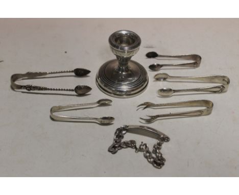 A BAG OF HALLMARKED SILVER TO INCLUDE A CANDLESTICK, SUGAR TONGUES AND A BRACELET