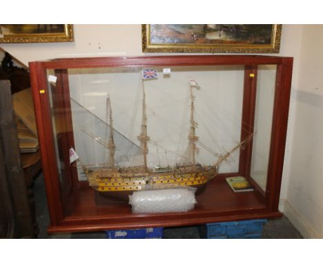 A LARGE GLASS CASED HAND MADE MODEL OF A GALLEON 