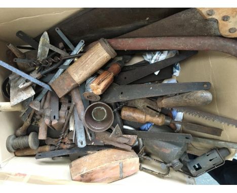 A large quantity of vintage tools and ironwork, to include woodsaws, chisels, and planes 