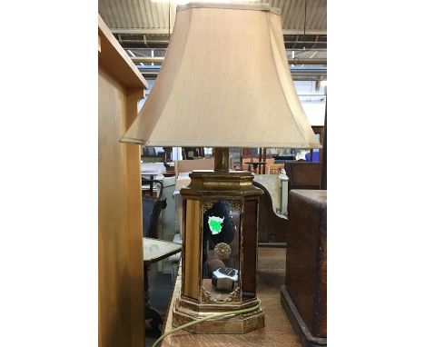 A gilt and mirrored table lamp 