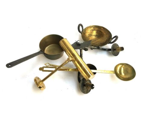 A brass saucepan, balti pan, several ladles, and a brass library light 