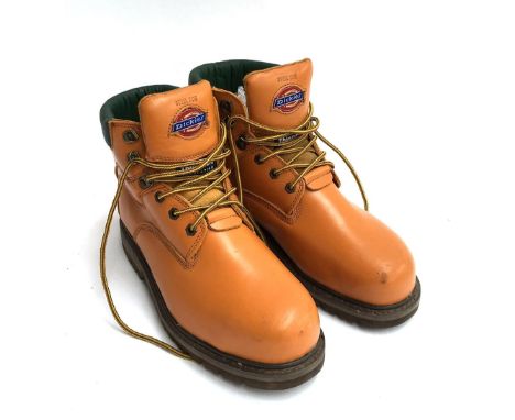 A new and unused pair of Dickies size 9 work boots with steel toe caps, together with a pair of Knight's roller blades 