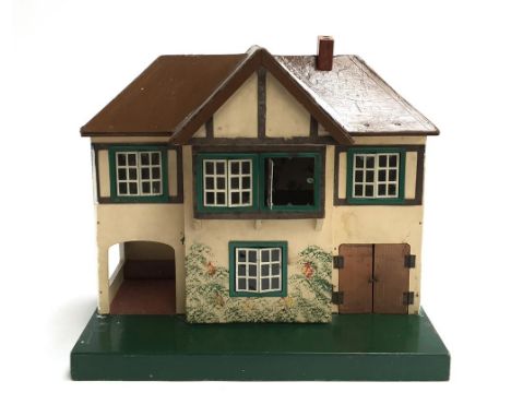A small vintage Tri-Ang wooden doll's house